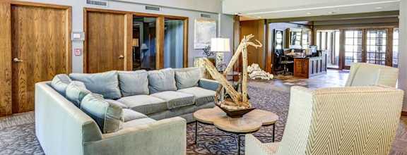 a living room with a couch and a table at The Falls, Mission, Kansas
