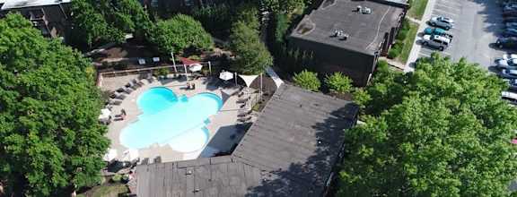 an aerial view of a house with a swimming pool at London House Apartments, Kansas