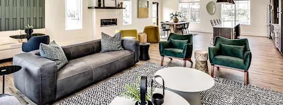 a living room filled with furniture and a large window