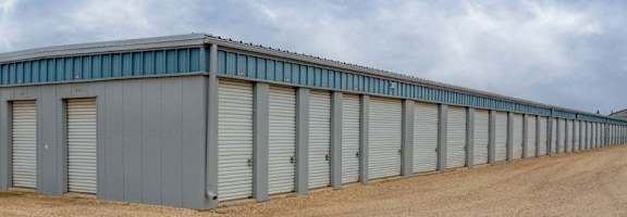A long row of storage units with closed doors.