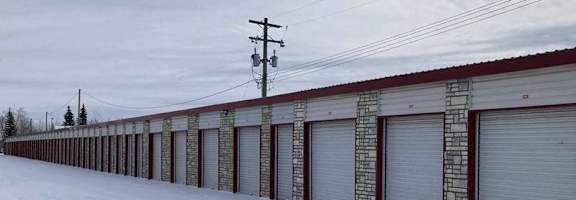 A long row of garage doors are closed.
