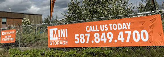 A storage facility sign with the text "CALL US TODAY 587.849.4700" is displayed.