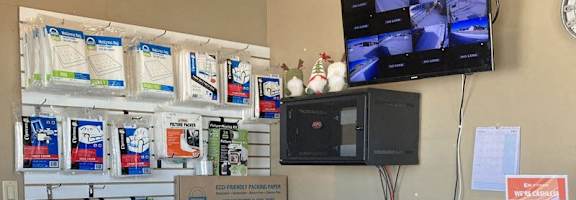 A store with a counter and a sign that says "MINI MALL".