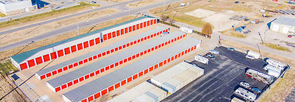 An aerial view of a large building with a red and white striped facade.