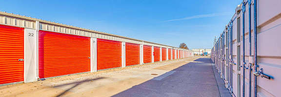 A long row of red storage units with the number 22 on the first one.