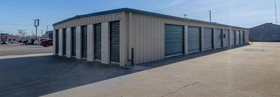 A storage facility with a sunny sky above.