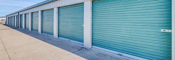 A long row of closed blue storage units.