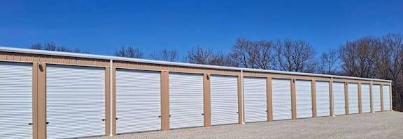 A long row of storage units with closed doors.