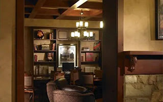 A living room with a couch and a chair.