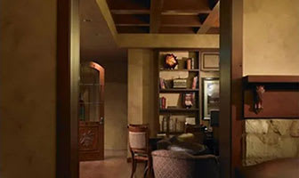 A room with a chair and a table.