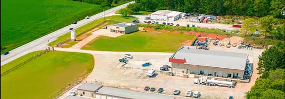an aerial view of several buildings and a parking lot