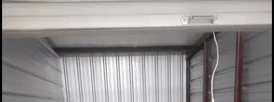 the inside of a garage with a concrete floor