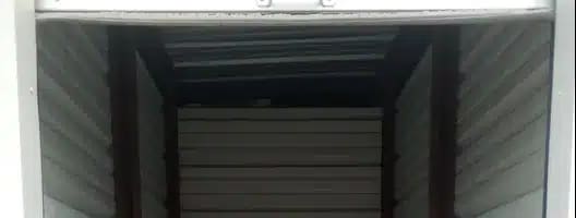 the inside of a small closet with white flooring and white walls