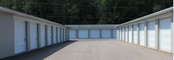 a row of garage doors in a parking lot