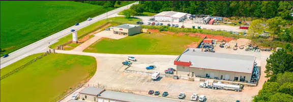 an aerial view of several buildings and a parking lot