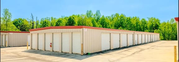 a row of storage units in a parking lot