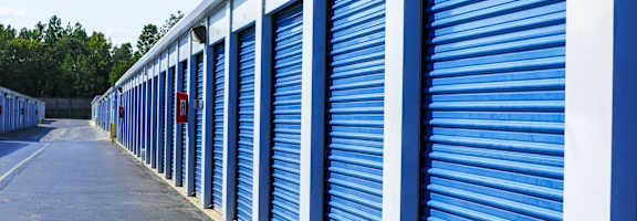 A long row of blue storage units with white trim.
