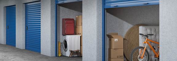 A storage room with blue doors and a bicycle inside.