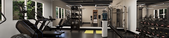 A gym with a variety of equipment including treadmills, weights, and exercise machines.