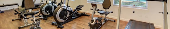the fitness center at Versailles Senior Apartments