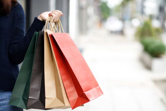 a woman holding a bunch of shopping bags at Discovery at Kingwood, Kingwood, 77339