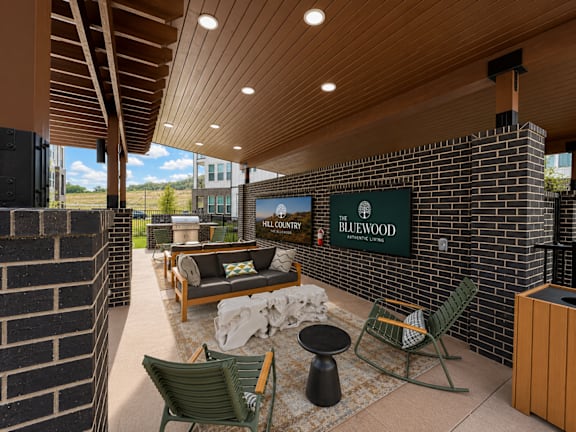 Covered outdoor patio with Hill Country views at The Bluewood