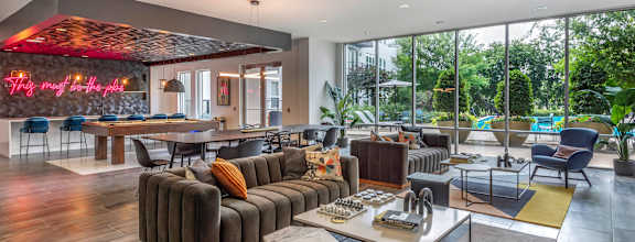 a rendering of a lobby with tables and chairs and triangles on the wall at Abstract at Design District, Dallas, TX, 75207