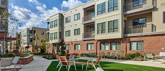 Lansdale Station Apartments banner including outdoor seating and balconies
