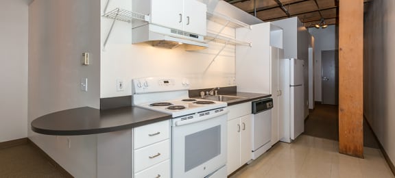 Kitchen With White Cabinetry And Appliances at Mercantile Housing, Colorado