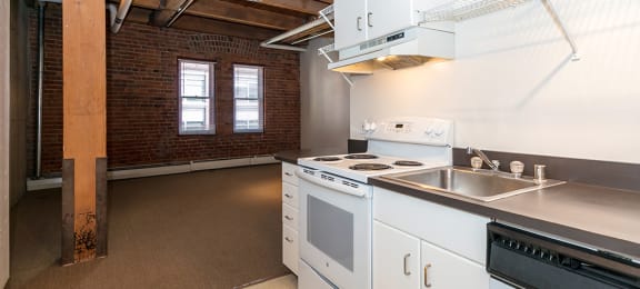 Electric Range In Kitchen at Mercantile Housing, Colorado, 80202