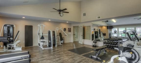 Fitness Center with plank flooring and mirrored wall at Parkside Apartments, Gresham, Oregon, 97080