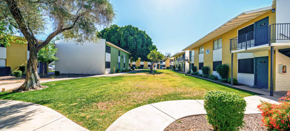 Exterior courtyard with grass and trees