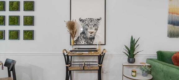 a home office with a desk and a leopard on the wall