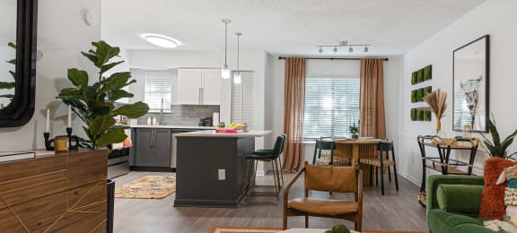 an open floor plan with a kitchen and living room