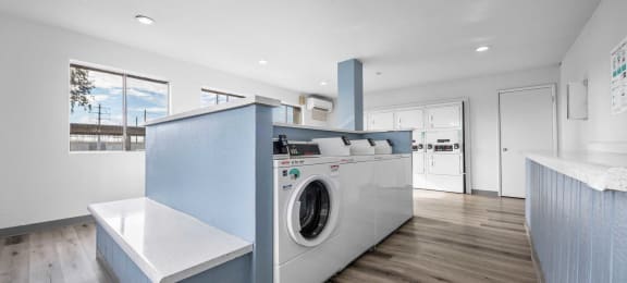 a kitchen with a washing machine in it