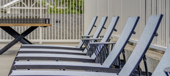 a row of deck chairs on a patio