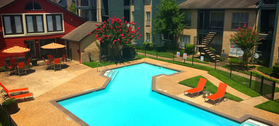 Community pool with lounge chairs