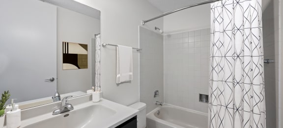 a bathroom with a sink and a shower and a toilet at Presidential Towers, Chicago, IL