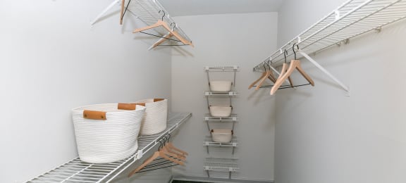 our spacious walk in closets are equipped with shelves and baskets for storage of laundry at Briarcliff Apartments, Georgia