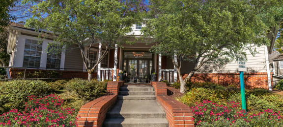 the front of a house with stairs and a sidewalk at Briarcliff Apartments, Atlanta, 30329
