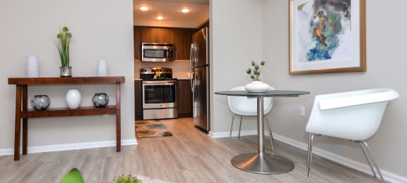 a living room with a dining room and a kitchen at Apartments at Denver Place, Colorado