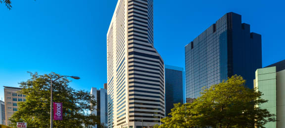 a tall skyscraper in a city with other tall buildings  at Apartments at Denver Place, Colorado, 80202