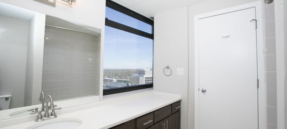 a bathroom with a sink and a window  at Apartments at Denver Place, Colorado