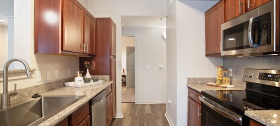 redesigned kitchen with granite counter tops and stainless steel appliances at the reserve at south coast