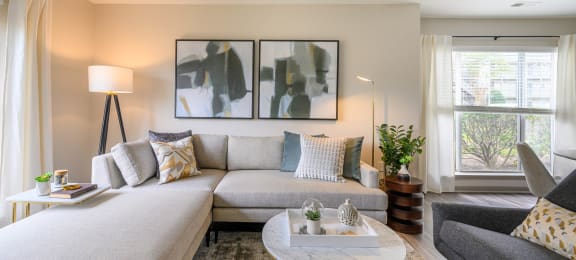 a living room with a couch and a coffee tableat Ashford Green, Charlotte, North Carolina 28262