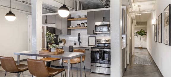 a kitchen and dining area in a loft at Highland Mill Lofts, Charlotte, North Carolina
