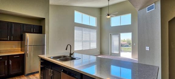 a kitchen with a counter top and a sink at Ridge at Thornton Station Apartments, Thornton, 80229
