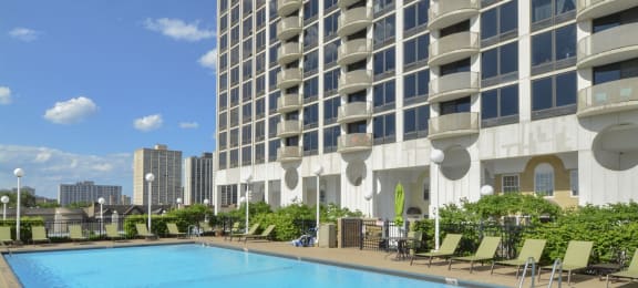 a large swimming pool in front of a tall building at The Montrose, Chicago, IL