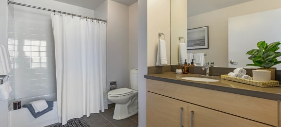 a bathroom with a shower and a sink and a toilet  at Vue, California, 90731