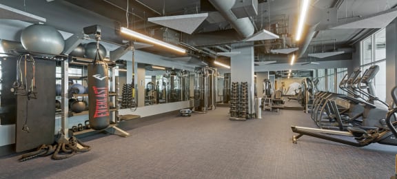 a gym with weights and other exercise equipment in a building  at Vue, San Pedro, CA